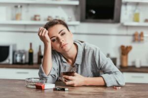 A woman mixing Ambien and alcohol at home.