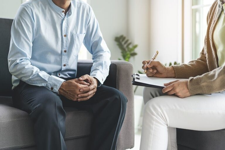 A man talking to a therapist about the best residential treatment option.