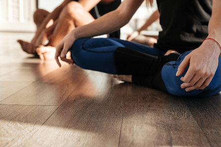 Women sitting cross-legged on the floor