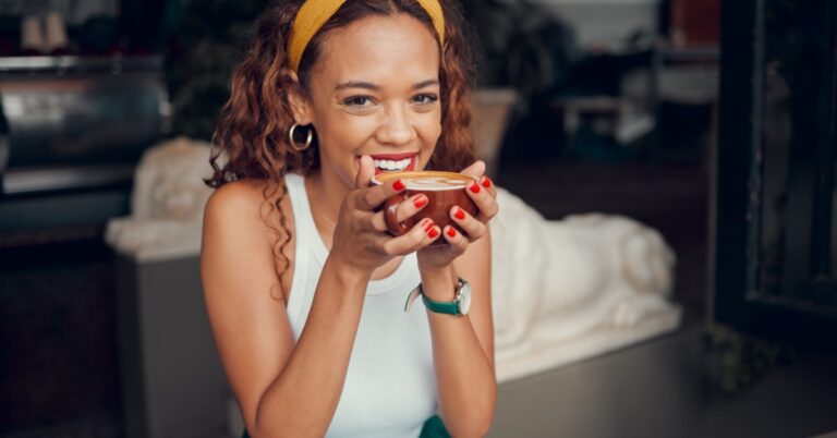 happy woman with a cup of coffee