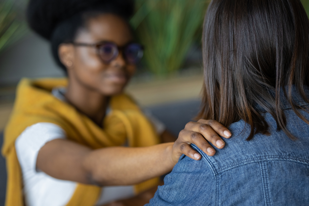 African American woman psychologist supports her patient,
