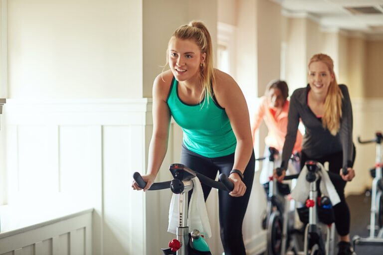 Women in exercise bikes
