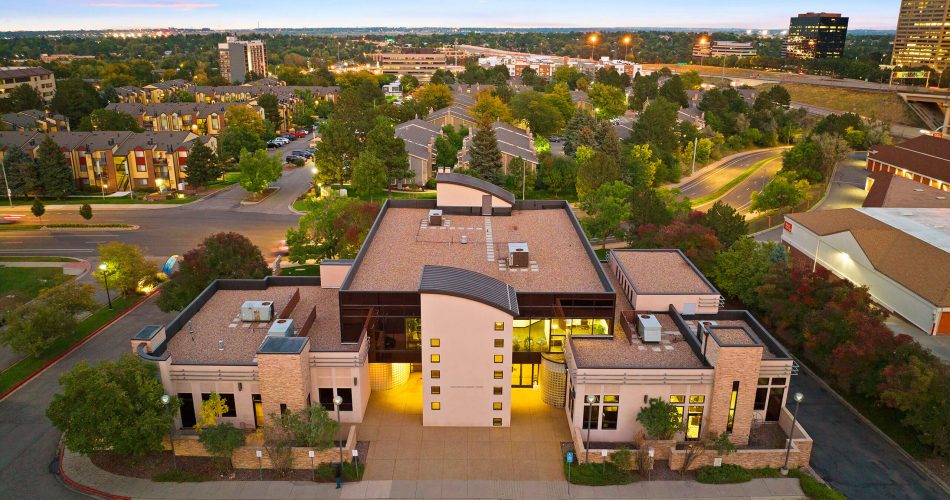 Aerial view of The Raleigh House building and surrounding area at twilight